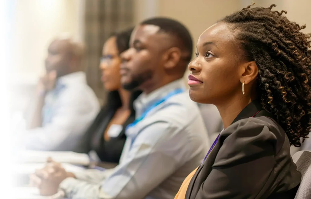 Professionals participating in an international training seminar